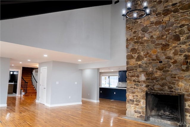 unfurnished living room with a fireplace and wood-type flooring