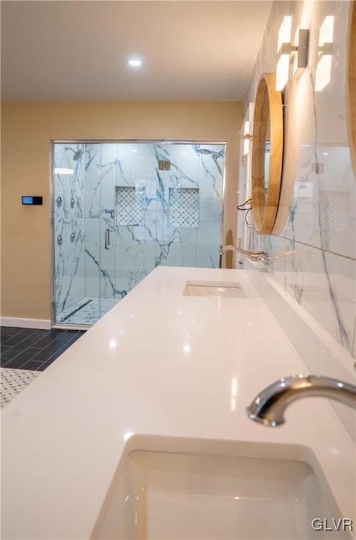 bathroom with vanity and an enclosed shower