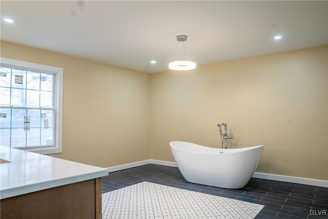 bathroom with hardwood / wood-style floors and a bathtub