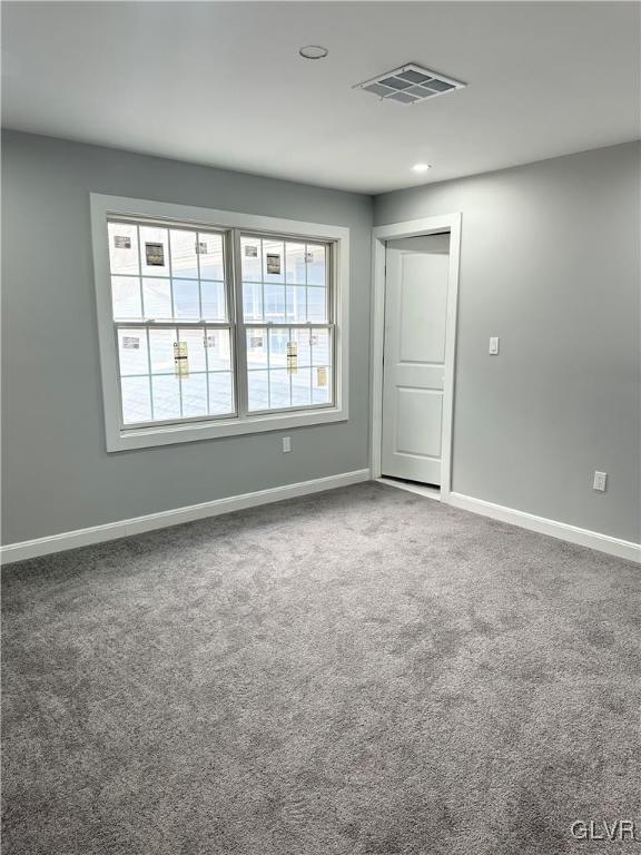 empty room with carpet flooring