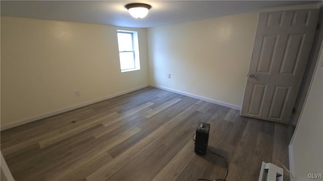 unfurnished room with dark hardwood / wood-style floors