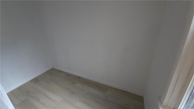 empty room with light hardwood / wood-style floors