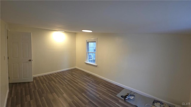 basement featuring dark hardwood / wood-style flooring