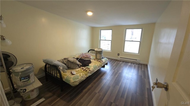 living room with dark hardwood / wood-style floors and baseboard heating