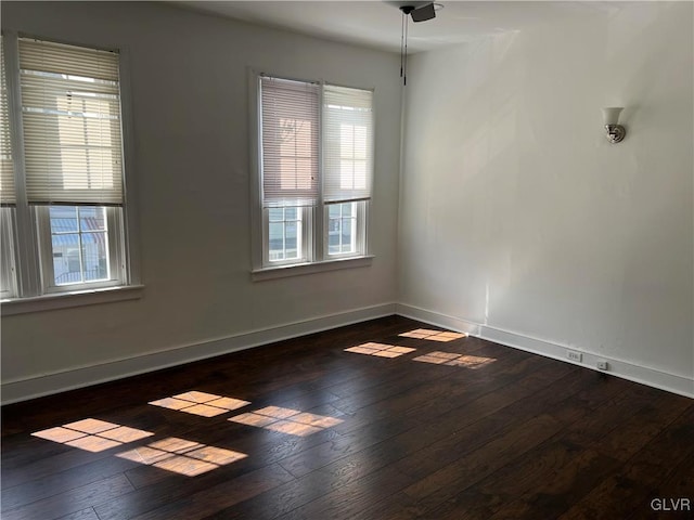 spare room featuring dark hardwood / wood-style floors