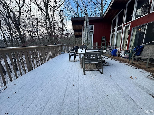 view of snow covered deck