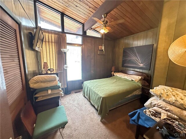 carpeted bedroom with ceiling fan, wooden walls, wood ceiling, and lofted ceiling