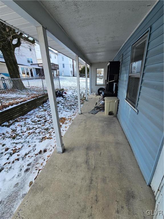 view of snow covered patio