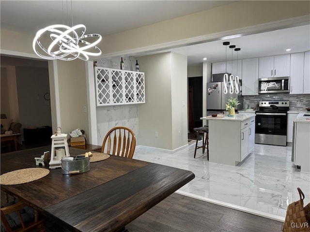 dining space featuring a chandelier