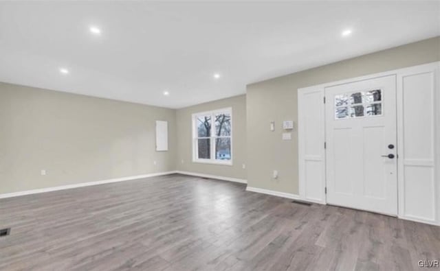 foyer entrance with light wood-type flooring