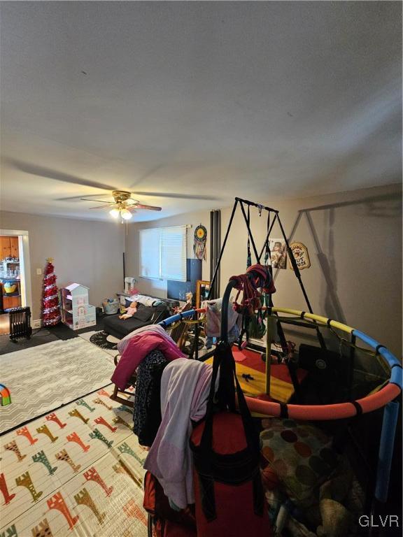 bedroom featuring ceiling fan and carpet floors