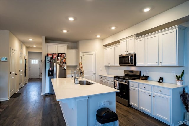 kitchen featuring dark hardwood / wood-style floors, sink, white cabinetry, and stainless steel appliances