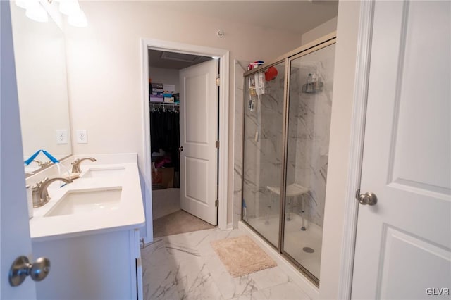 bathroom featuring vanity and a shower with shower door