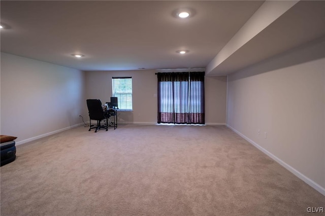 unfurnished office featuring light carpet