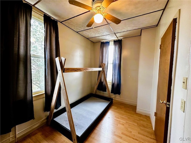 unfurnished bedroom featuring ceiling fan and light hardwood / wood-style floors