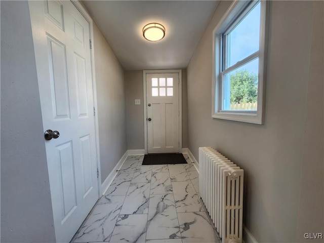 doorway to outside with radiator heating unit