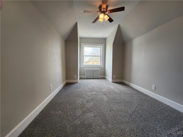 bonus room with radiator heating unit, carpet floors, vaulted ceiling, and ceiling fan