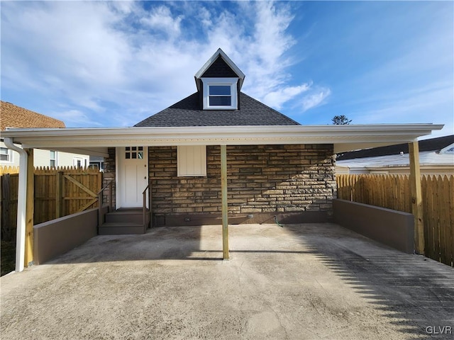 view of front of house featuring a carport