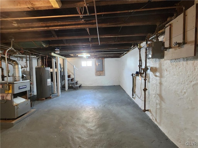 basement featuring electric water heater and electric panel