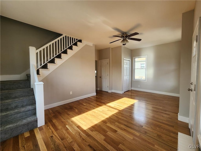 unfurnished living room featuring hardwood / wood-style floors and ceiling fan