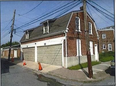 view of side of property featuring a garage