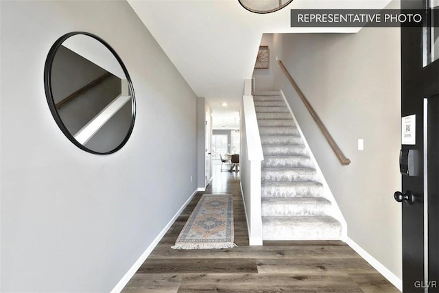 stairs with hardwood / wood-style flooring