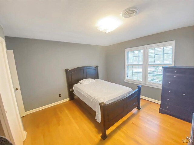 bedroom featuring hardwood / wood-style flooring