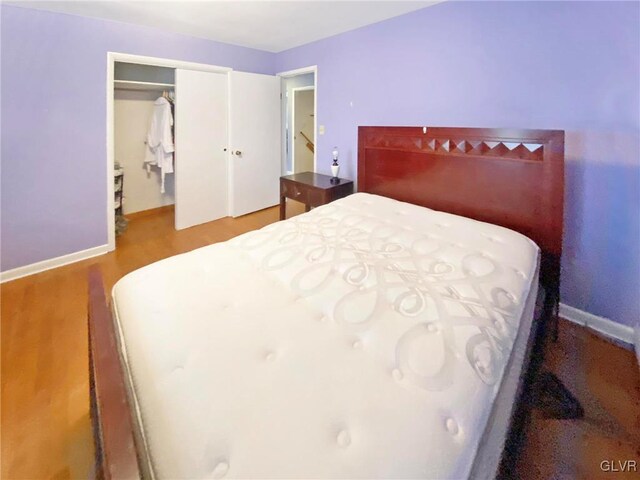 bedroom featuring a closet and wood-type flooring