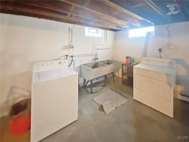 washroom featuring separate washer and dryer and sink