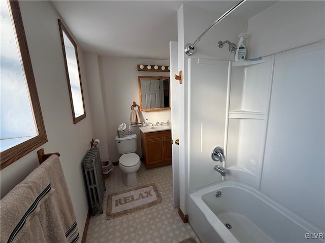 full bathroom with vanity,  shower combination, toilet, and radiator heating unit