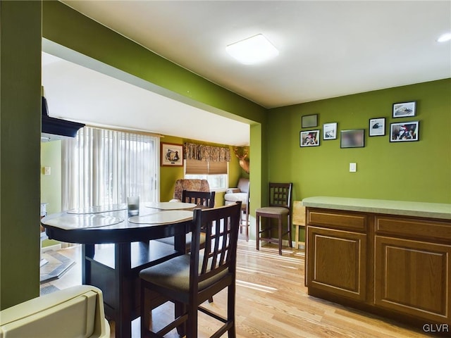 dining area with light hardwood / wood-style flooring