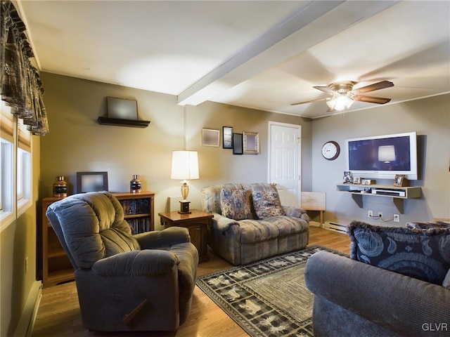 living room with beamed ceiling, hardwood / wood-style flooring, baseboard heating, and ceiling fan