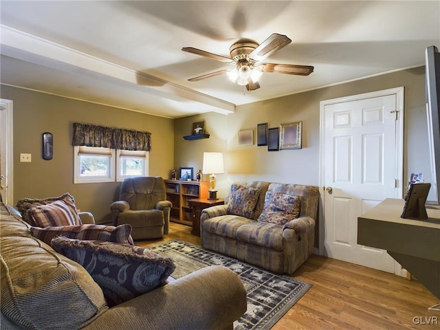 living room featuring hardwood / wood-style flooring and ceiling fan