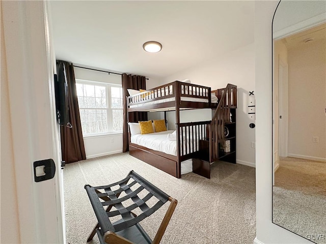 bedroom featuring light colored carpet