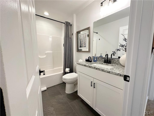 full bathroom with shower / bath combination with curtain, vanity, and toilet