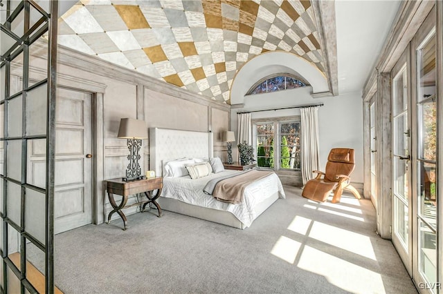 carpeted bedroom featuring vaulted ceiling