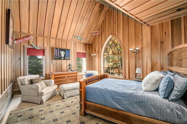 bedroom featuring lofted ceiling, light hardwood / wood-style flooring, wooden walls, and wood ceiling