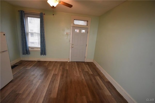 entrance foyer featuring ceiling fan and dark wood-type flooring