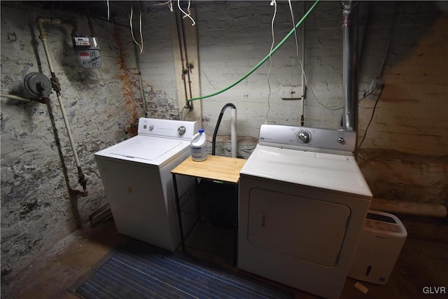 washroom with washer and dryer