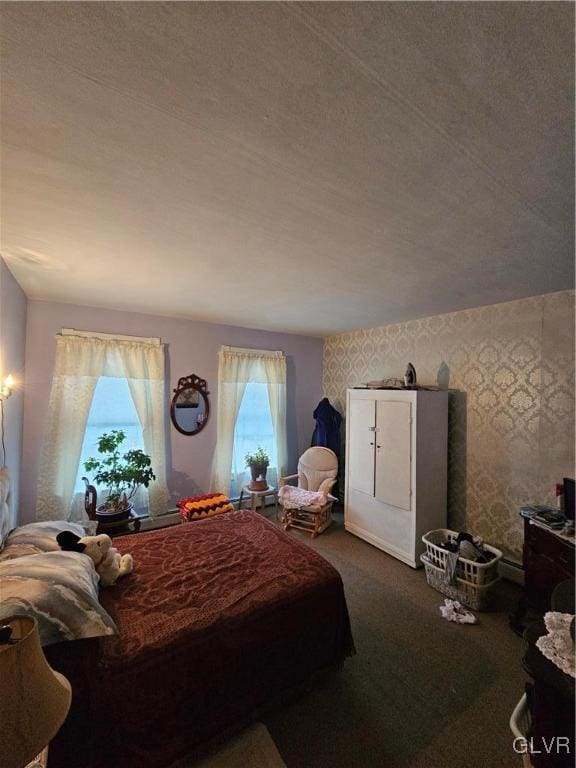 carpeted bedroom featuring a textured ceiling