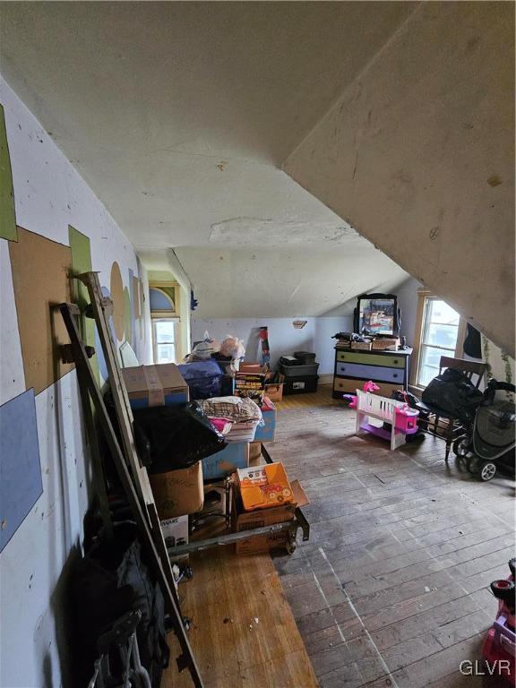 bonus room featuring vaulted ceiling