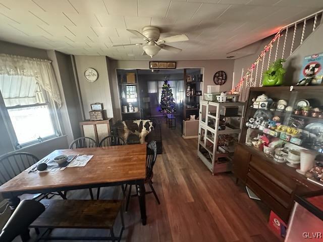 dining space with hardwood / wood-style flooring and ceiling fan