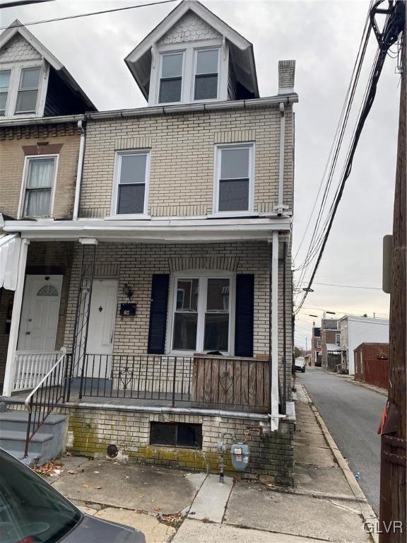 townhome / multi-family property with covered porch