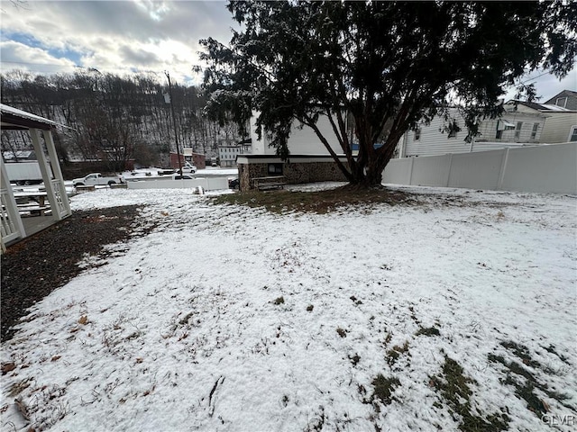 view of yard layered in snow