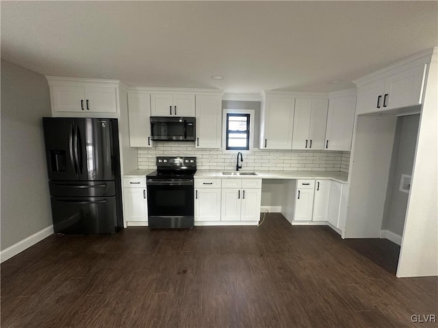 kitchen featuring dark hardwood / wood-style flooring, white cabinets, and black appliances