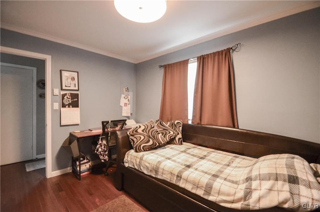 bedroom featuring dark hardwood / wood-style flooring and ornamental molding