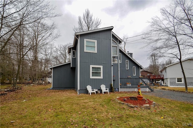 back of house featuring a yard