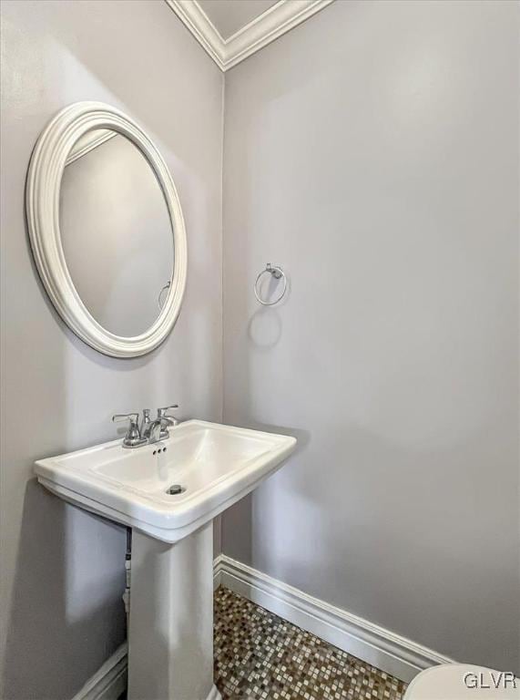 bathroom featuring tile patterned flooring and ornamental molding