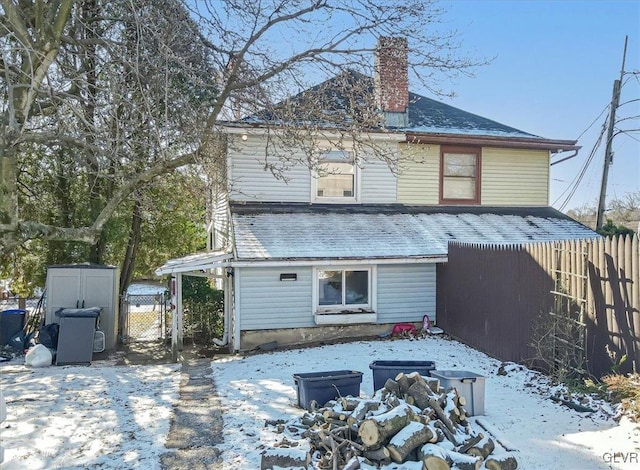 view of snow covered house