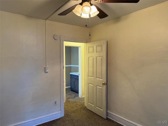 carpeted empty room with ceiling fan